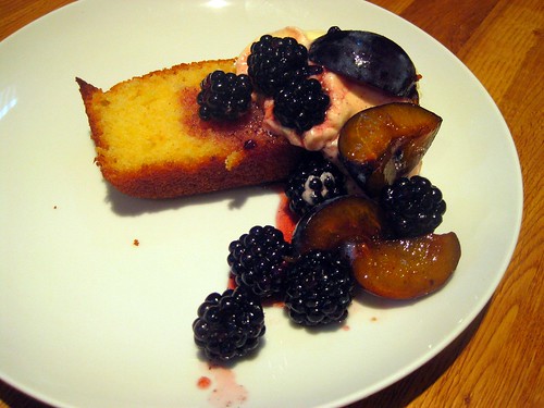 Orange polenta cake with whipped cream and vanilla-scented blackberry and plum compote