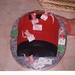 Christmas cake in the shape of a postbox with mice posting cards.