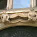 Close up of gargoyles above side entrance to Gloucester Cathedral