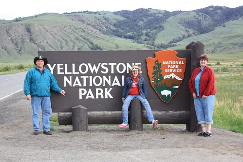 mom at yellowstone national park north entrance sign