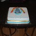 Square 50th birthday cake with a dalek and Dr Who's scarf on.