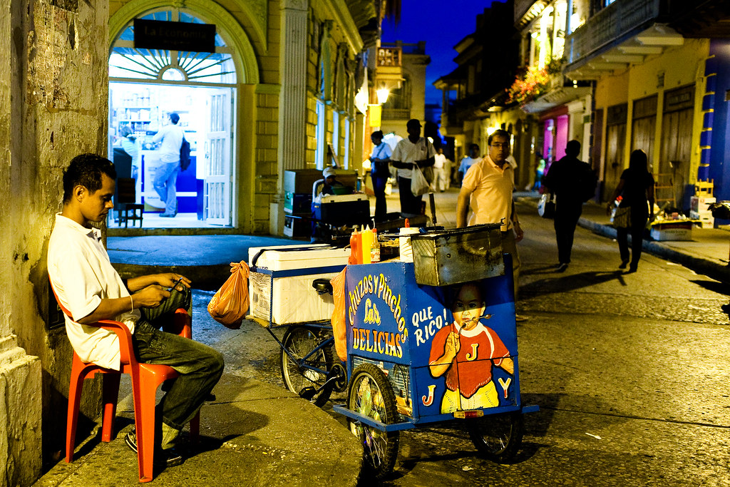 Man sitting on the street selling BBQ sticks for $1 USD each. Cartagena doesn't have much street food (compared to say Thailand) but at the end of the night, it's a refreshing treat to get something quick and easy outside the bar when nothing else is open at 2am. 