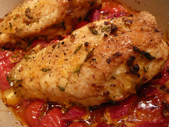 Chicken on peppers and tomatoes