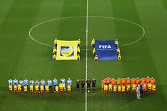 The teams line up for the national anthems 