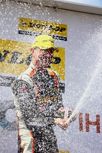 Matt Neal celebrates his BTCC win on the podium at Thruxton, May 2017