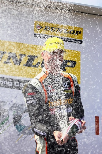 Matt Neal celebrates his BTCC win on the podium at Thruxton, May 2017