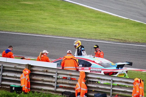 Tom Ingram gets out of his stricken car off the track at Oulton Park, May 2017