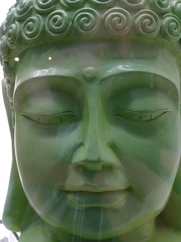 Buddha image in the store window of an optician shop in Wittenberg (Germany)