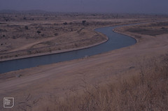 Life-giving water flows from Tiga Dam to parched landscape south of the Sahel 1981