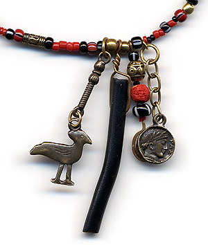 Necklace featuring red coral, black branch coral and brass charms