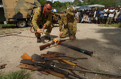 Members of RAMSI military destroy surrendered weapons, west Honiara. Solomon Islands 2003. Photo: Sean Burton © Australian Defence