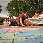 Student decorates the Brickyard during Earth Day activities.
