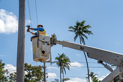 A worker repairing power lines in Loiza, Puerto Rico
